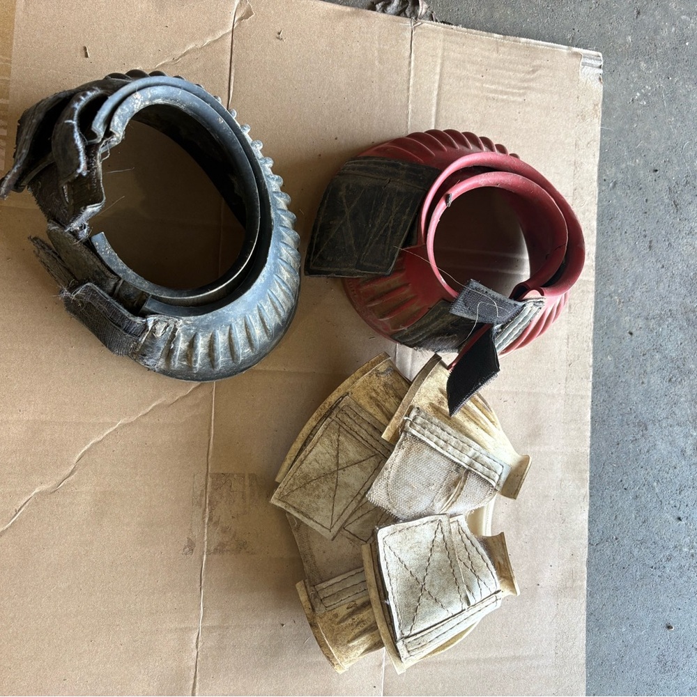 Three pairs of size medium horse bell boots